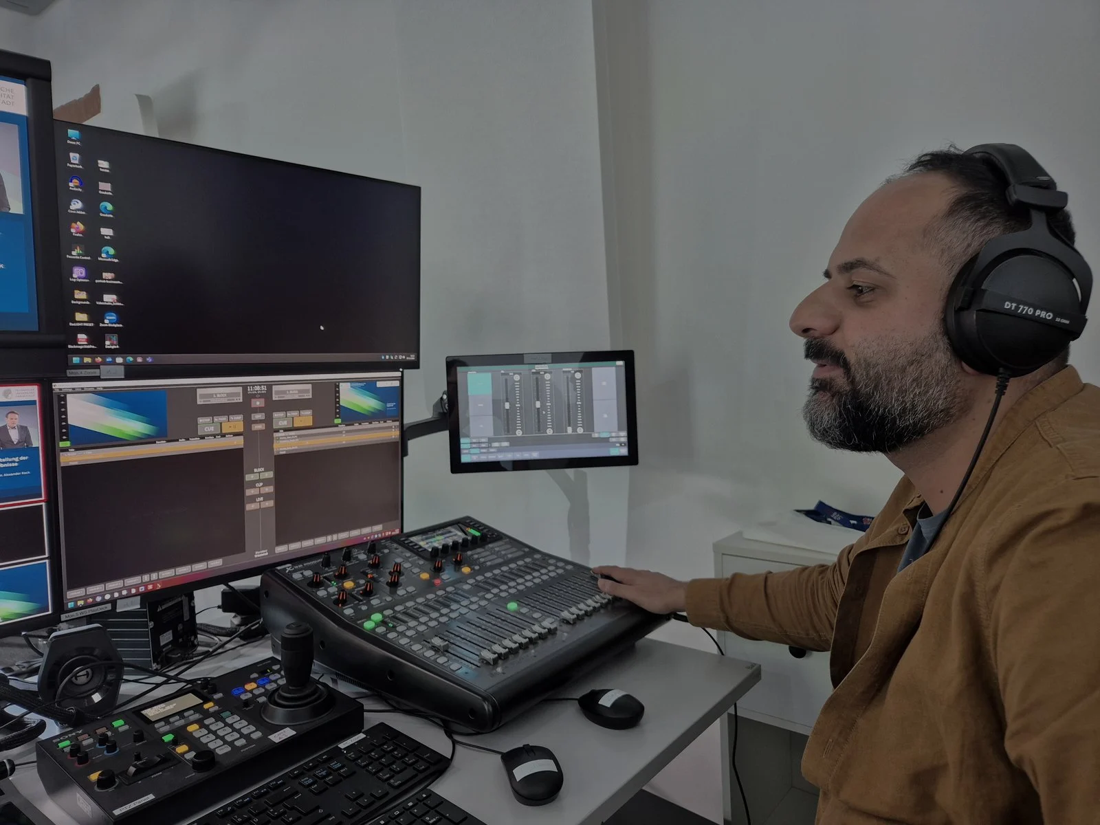 Mostafa Tabatabaei operating hybrid media production controls