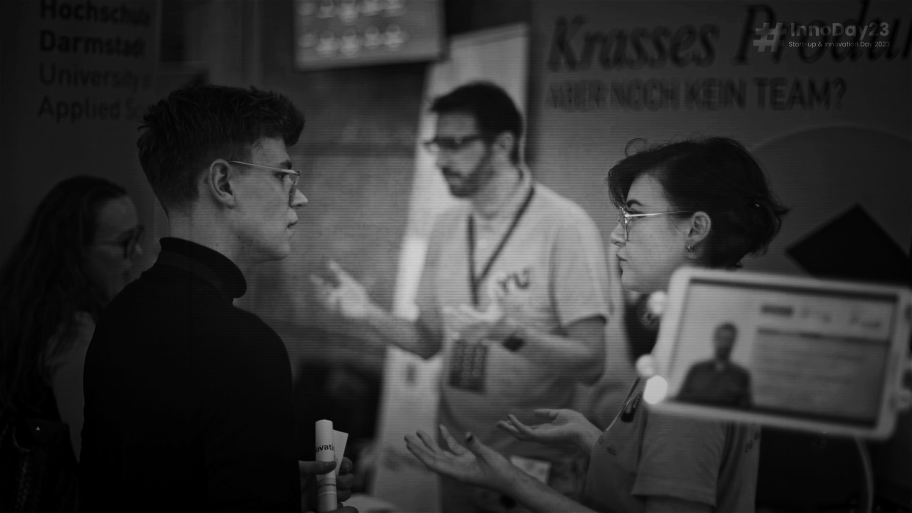 Public engagement environment with people discussing ideas at an innovation event